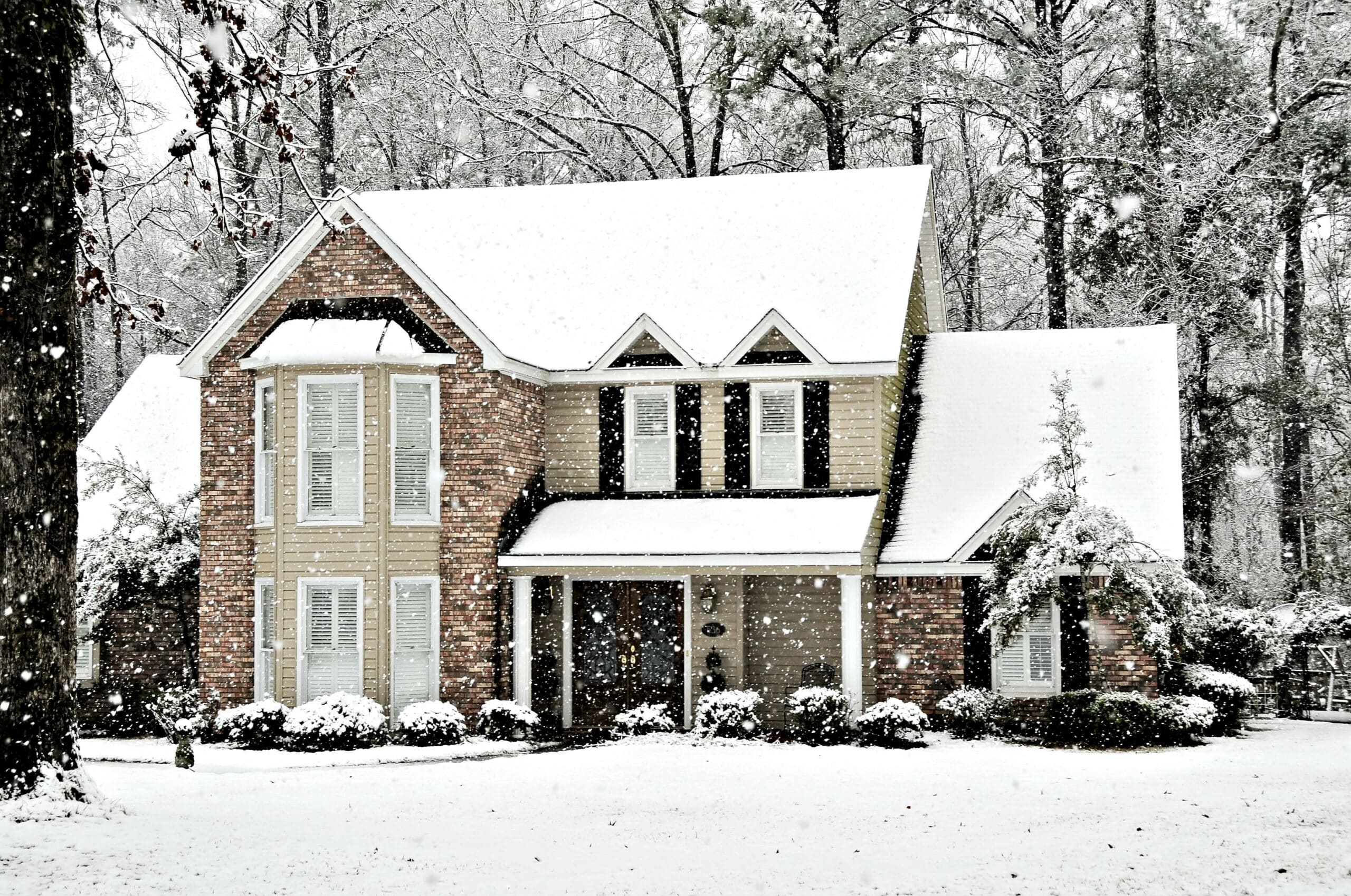 front of house while it's snowing outside
