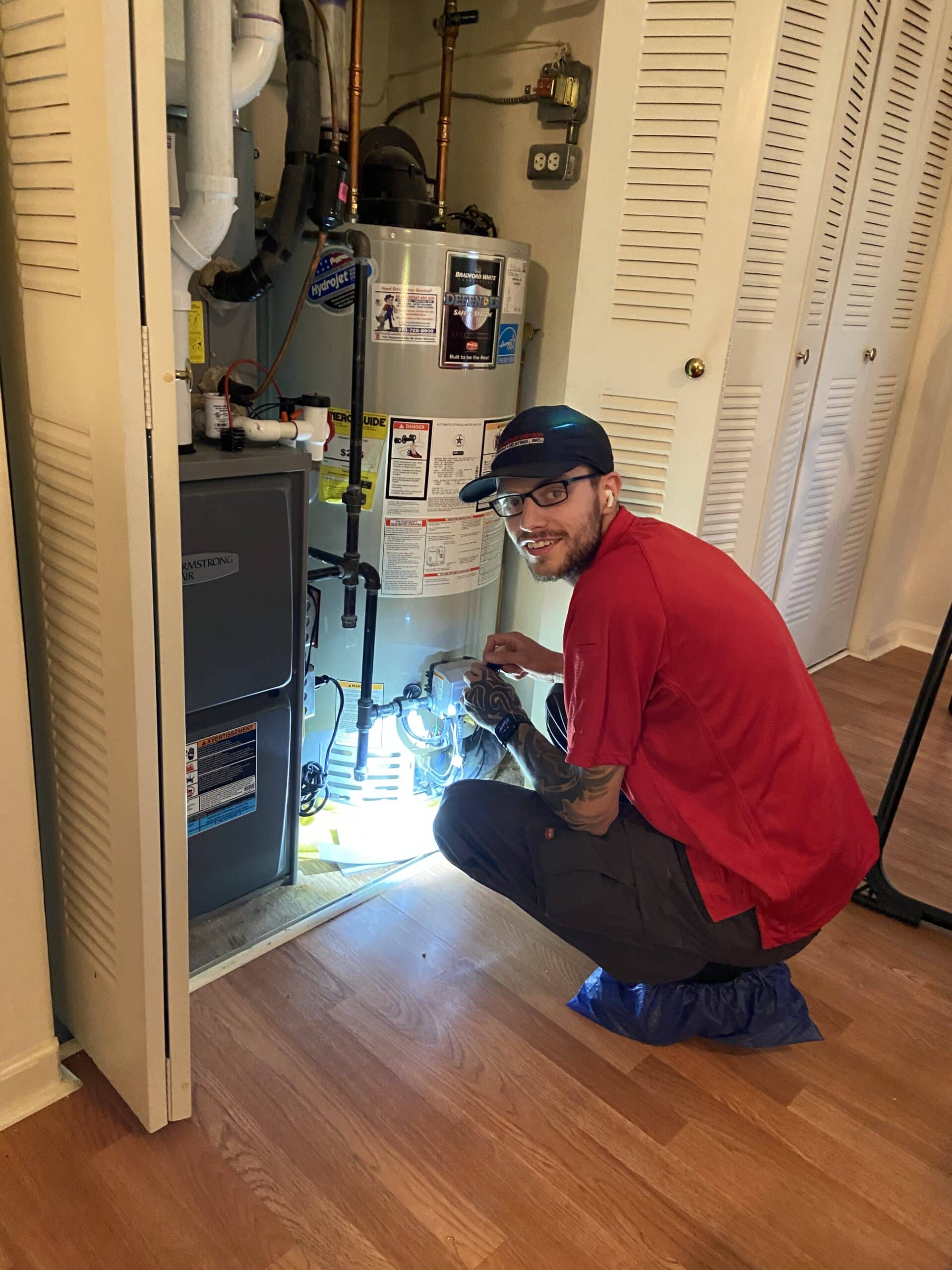 west milford HVAC technician inspecting system