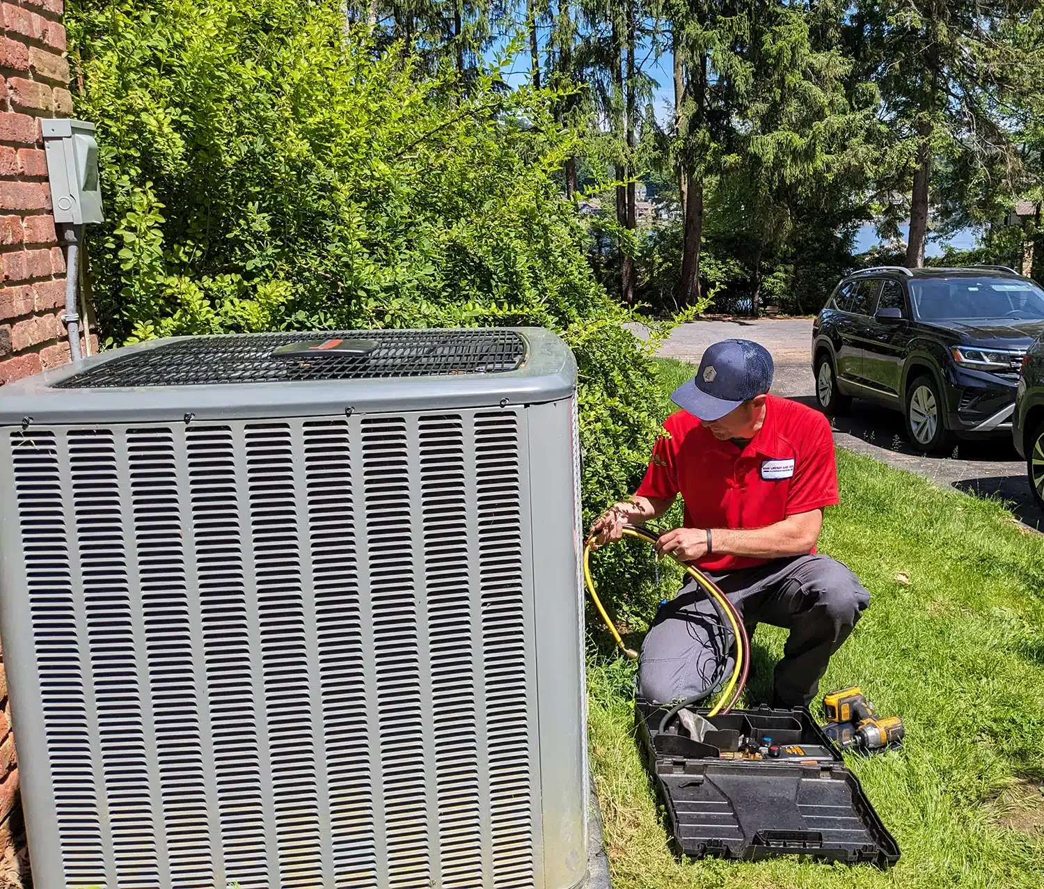 Mark Lindsay service technician working on outdoor ac unit.