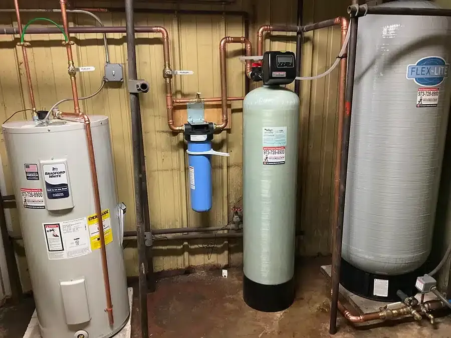 Water softener, sediment filter, and well tank system installed in West Milford area utility room