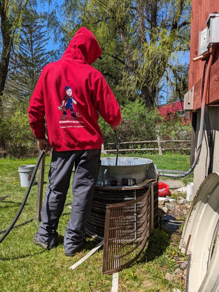 Outside AC repair in West Milford, New Jersey