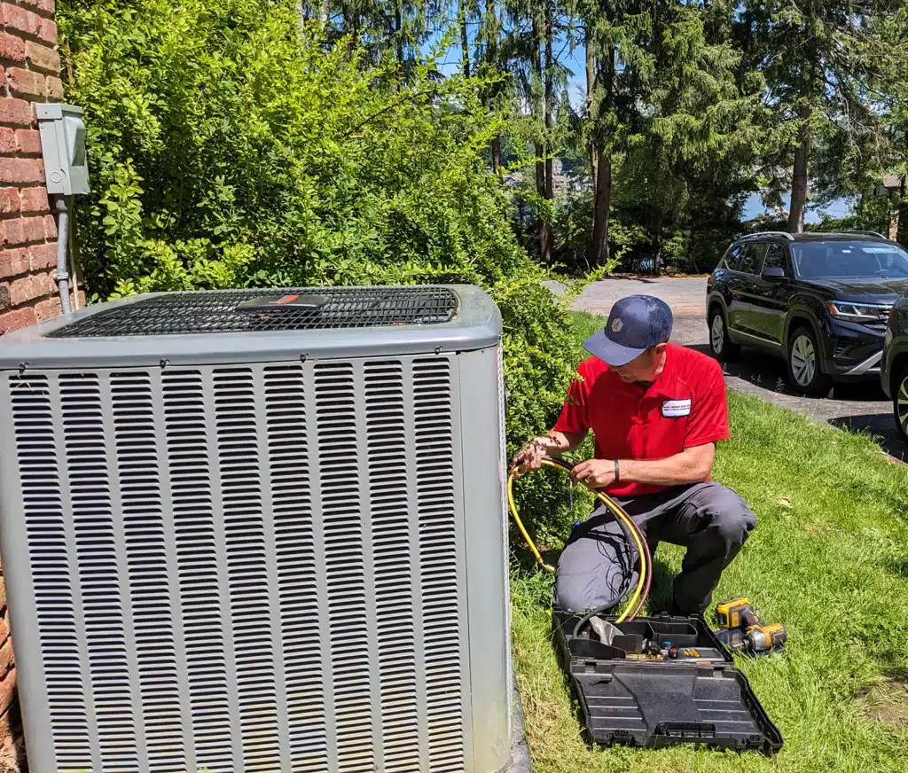 Mark Lindsay service technician working on outdoor ac unit.