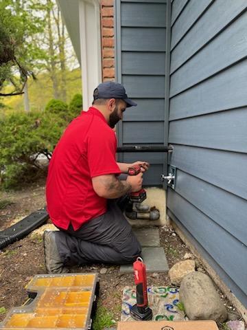Mark Lindsay plumber installing a hose spigot
